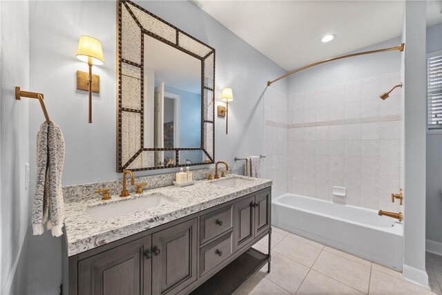 bathroom featuring tile patterned floors, vanity, and tiled shower / bath combo