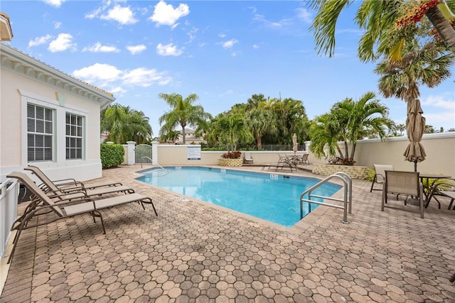 view of swimming pool featuring a patio area