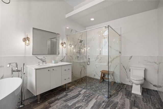 full bathroom with separate shower and tub, vanity, tile walls, and toilet