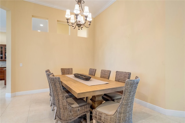 tiled dining room with ornamental molding and an inviting chandelier