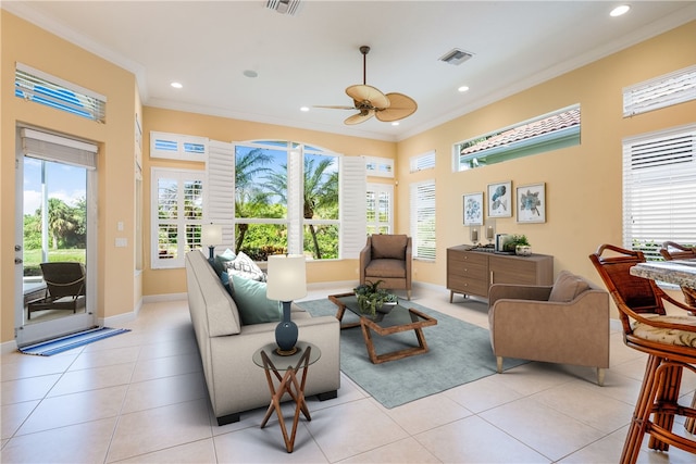 interior space with ceiling fan, plenty of natural light, and crown molding