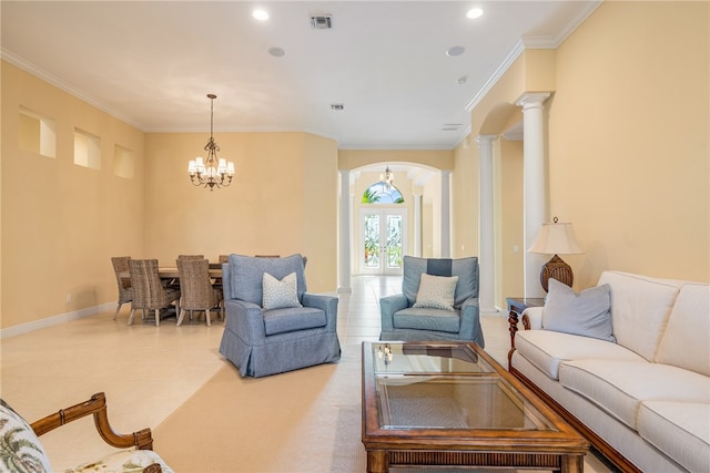 carpeted living room featuring decorative columns, french doors, a notable chandelier, and ornamental molding