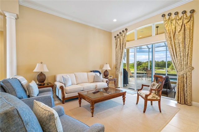 living room with decorative columns, light tile patterned floors, and ornamental molding