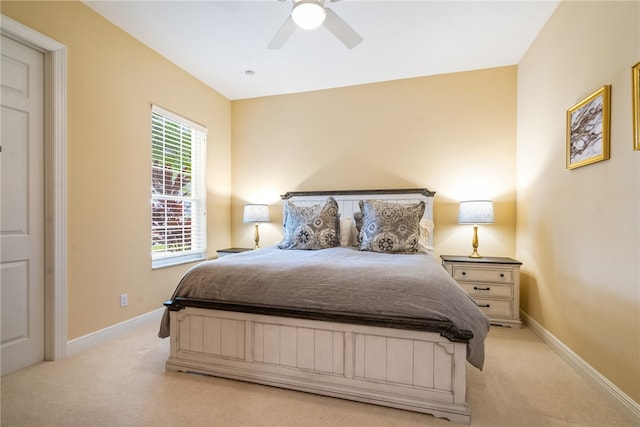 bedroom with light colored carpet and ceiling fan