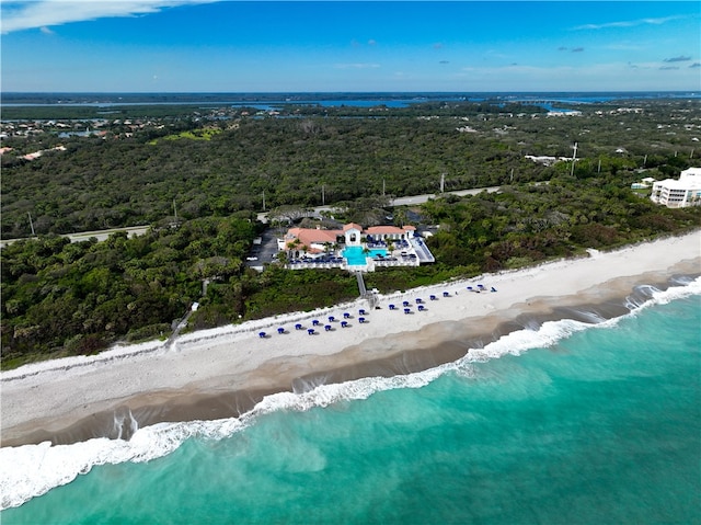 birds eye view of property with a view of the beach and a water view