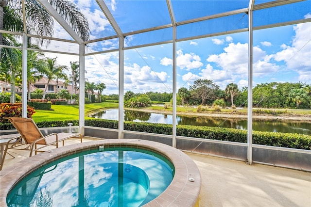 view of pool with a water view and glass enclosure