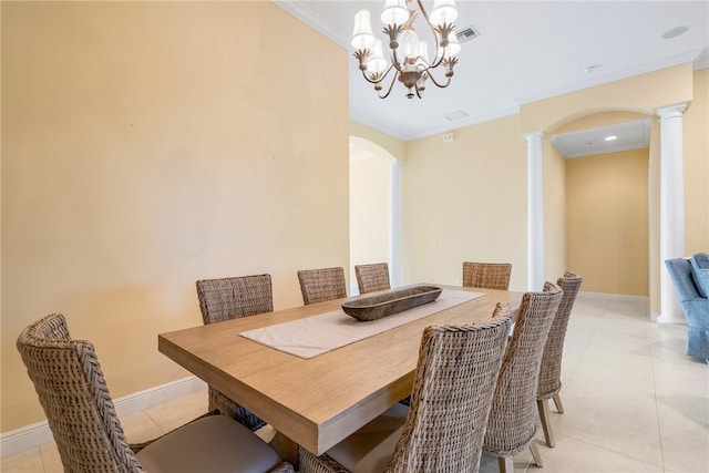 dining space with decorative columns, ornamental molding, light tile patterned floors, and a notable chandelier