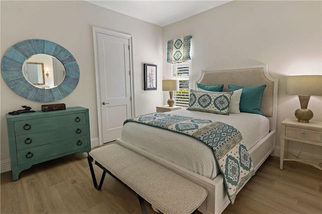 bedroom with light hardwood / wood-style flooring