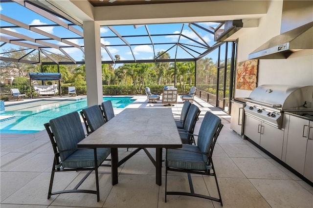 view of patio / terrace with pool water feature, an outdoor kitchen, grilling area, and glass enclosure