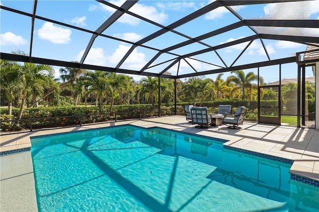 view of pool featuring a lanai and a patio