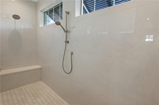 bathroom featuring a tile shower