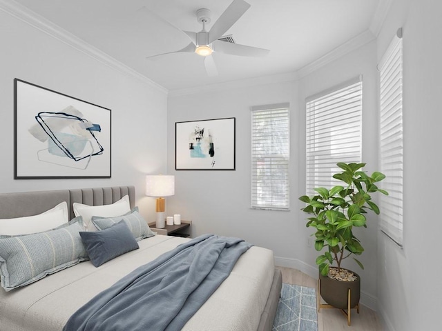 bedroom with hardwood / wood-style floors, ornamental molding, and ceiling fan