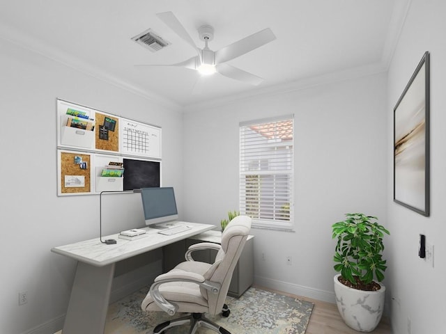 office area featuring crown molding, light hardwood / wood-style floors, and ceiling fan