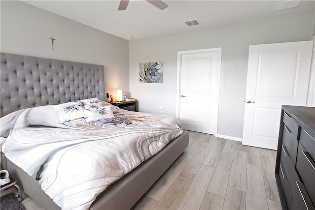 bedroom featuring ceiling fan and light hardwood / wood-style flooring