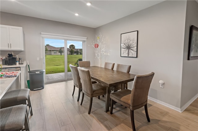 dining space featuring light wood-type flooring