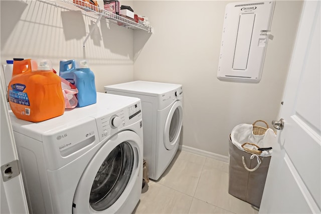 washroom featuring light tile patterned floors and independent washer and dryer