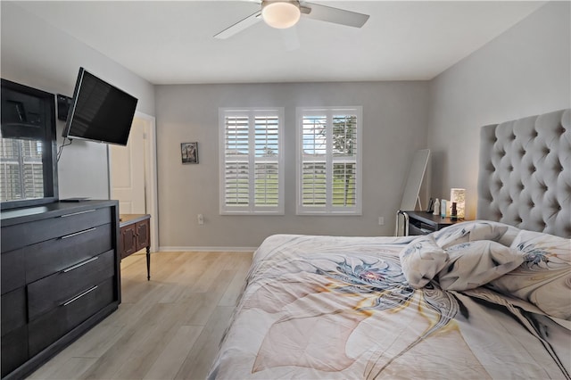 bedroom featuring light wood-type flooring and ceiling fan