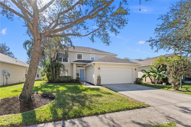 view of front facade with a garage and a front lawn