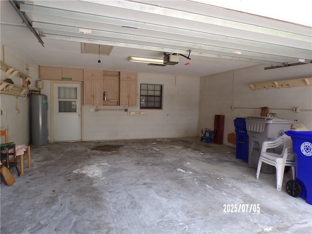 881 48th Ave, Vero Beach, FL 32966 - garage with water heater and a garage door opener