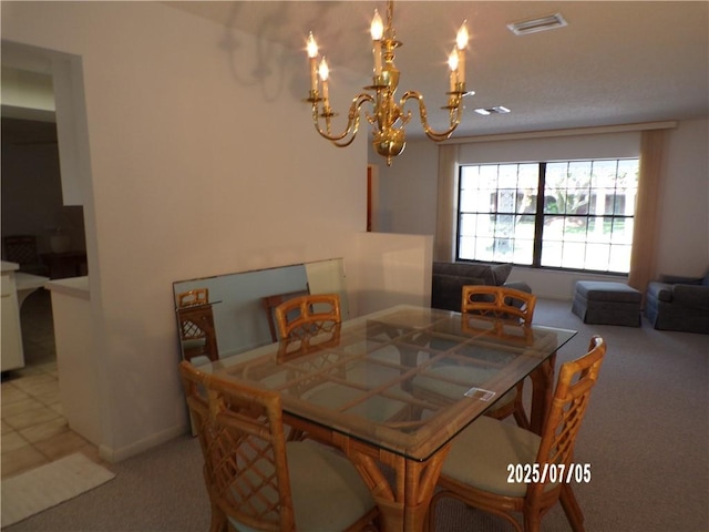 881 48th Ave, Vero Beach, FL 32966 - carpeted dining room featuring a chandelier and baseboards