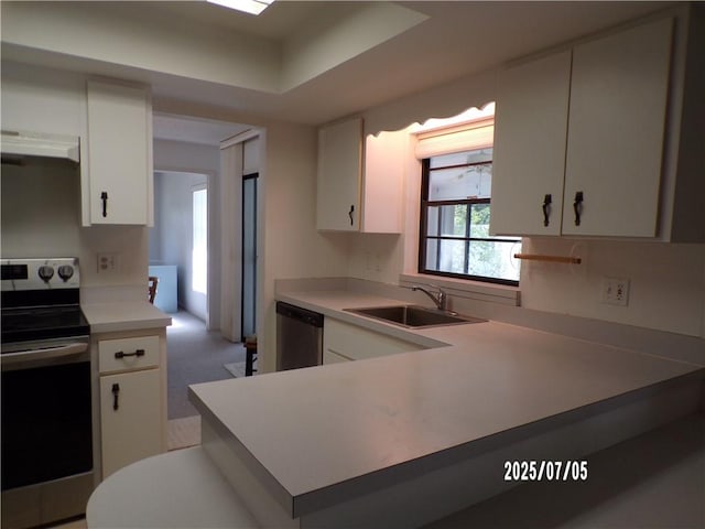 881 48th Ave, Vero Beach, FL 32966 - kitchen with stainless steel appliances, ventilation hood, light countertops, and white cabinetry