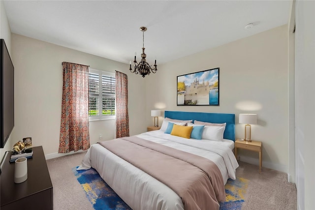 carpeted bedroom with an inviting chandelier