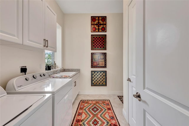 laundry area with cabinets, sink, light tile patterned floors, and washer and dryer