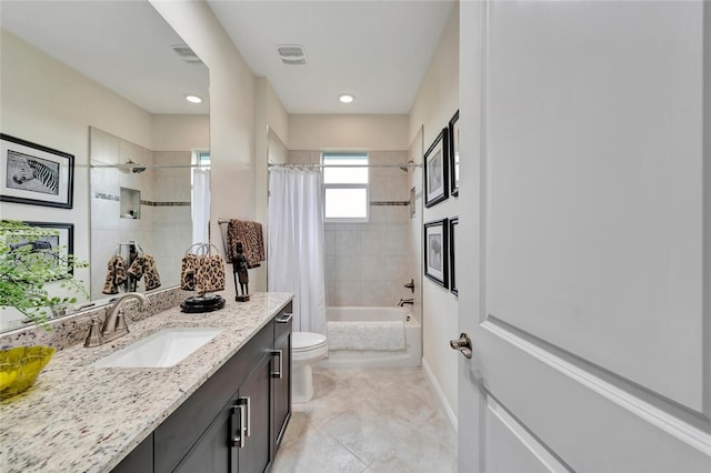 full bathroom featuring vanity, toilet, and shower / tub combo