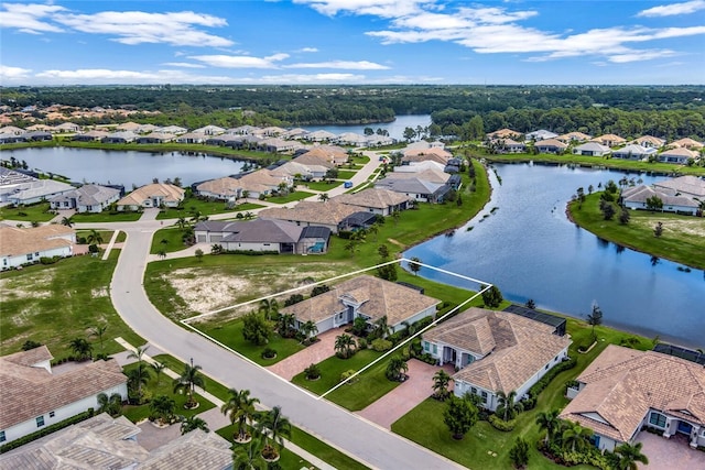 drone / aerial view with a water view