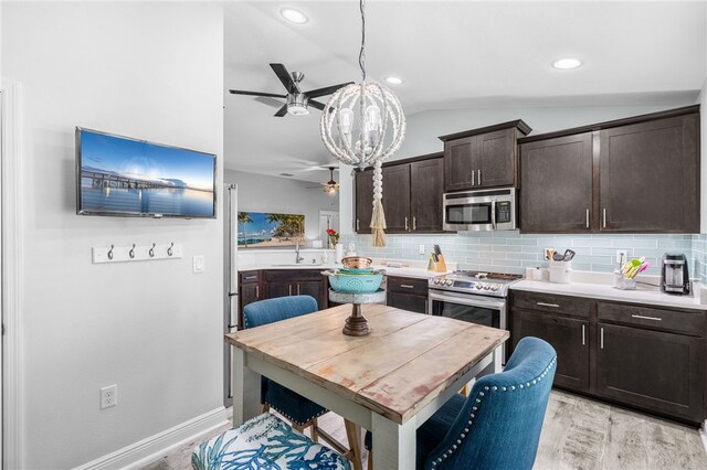 439 Briarcliff Cir, Sebastian, FL 32958 - kitchen featuring stainless steel appliances, a ceiling fan, dark brown cabinets, lofted ceiling, and light wood-style floors