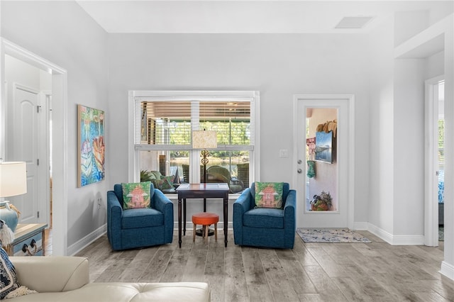 439 Briarcliff Cir, Sebastian, FL 32958 - living area with wood finished floors, baseboards, and plenty of natural light