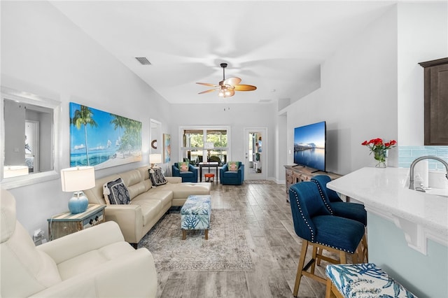 439 Briarcliff Cir, Sebastian, FL 32958 - living room with light wood-style flooring, a ceiling fan, and baseboards