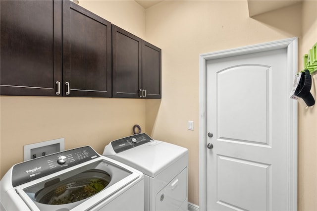 439 Briarcliff Cir, Sebastian, FL 32958 - laundry room with washer and clothes dryer and cabinet space