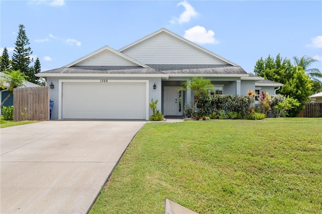 1368 Scroll St, Sebastian, FL 32958 - view of front of house featuring a garage, concrete driveway, stucco siding, and roof with shingles