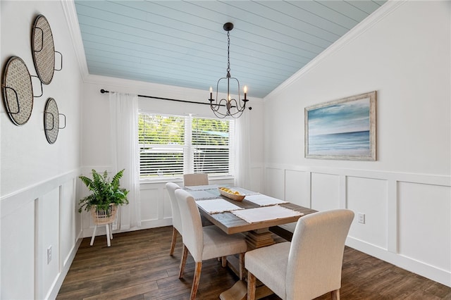 1368 Scroll St, Sebastian, FL 32958 - dining area with a decorative wall, a chandelier, ornamental molding, dark wood-type flooring, and lofted ceiling