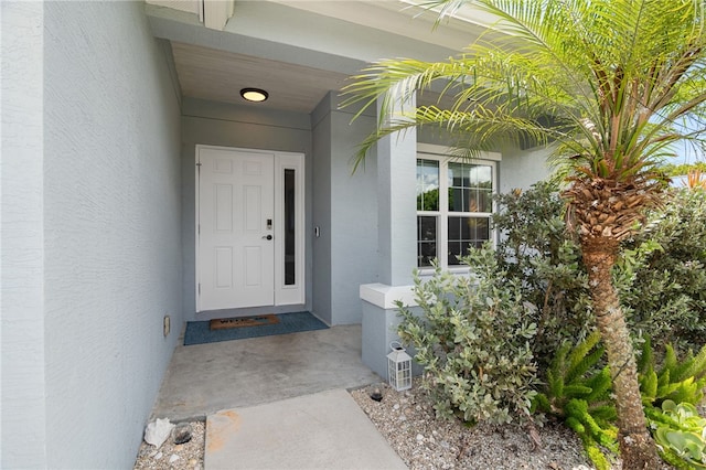 1368 Scroll St, Sebastian, FL 32958 - view of exterior entry featuring stucco siding