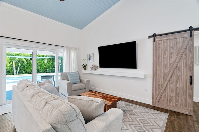 1368 Scroll St, Sebastian, FL 32958 - living room with ornamental molding, high vaulted ceiling, a barn door, wood finished floors, and wood ceiling