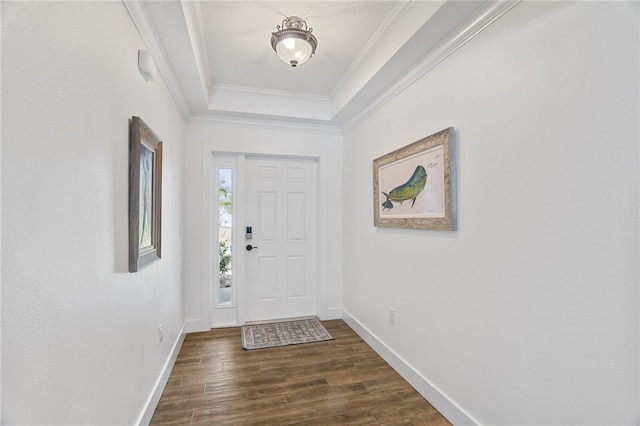 1368 Scroll St, Sebastian, FL 32958 - foyer featuring dark wood-type flooring, a raised ceiling, and crown molding