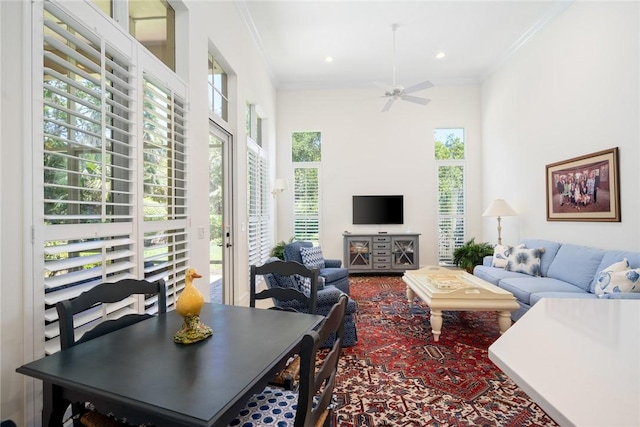 1624 Weybridge Cir, Vero Beach, FL 32963 - living room featuring a ceiling fan, ornamental molding, and plenty of natural light