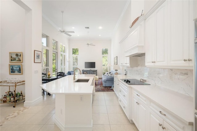 1624 Weybridge Cir, Vero Beach, FL 32963 - kitchen featuring open floor plan, a sink, a ceiling fan, and light tile patterned flooring