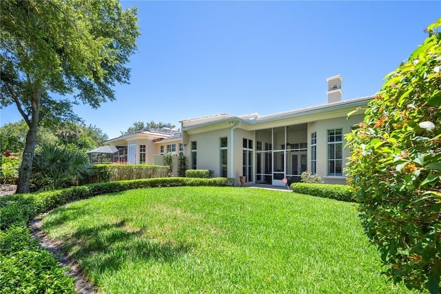 1624 Weybridge Cir, Vero Beach, FL 32963 - view of yard featuring a sunroom