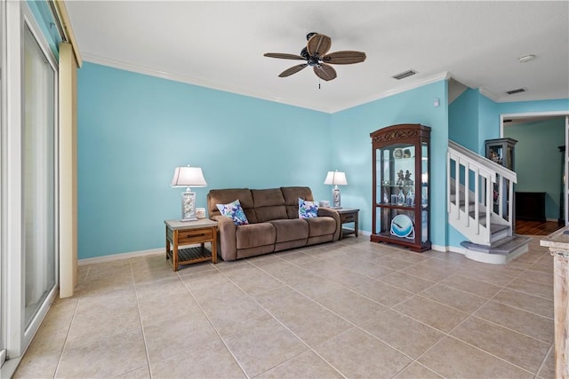 tiled living room featuring crown molding and ceiling fan