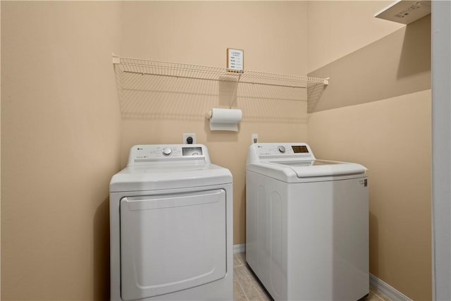 washroom featuring washing machine and dryer