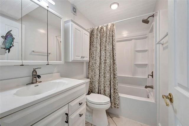 855 Dahlia Ln Unit 304, Vero Beach, FL 32963 - bathroom with vanity, tile patterned floors, toilet, and shower / bath combo with shower curtain