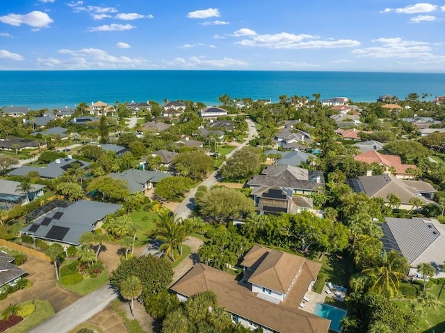 birds eye view of property featuring a residential view and a water view