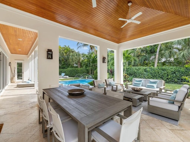 view of patio / terrace featuring an outdoor living space, a fenced in pool, and ceiling fan