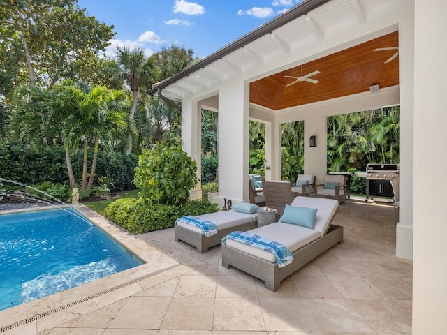 pool featuring area for grilling, a ceiling fan, and a patio