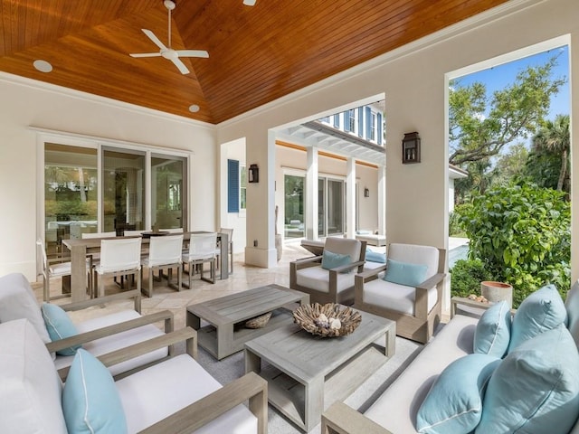 view of patio with an outdoor living space, outdoor dining area, and a ceiling fan