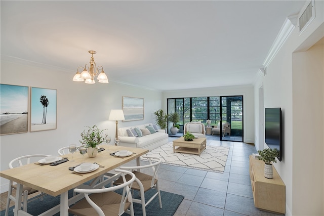 living room with light tile patterned floors, crown molding, and a notable chandelier