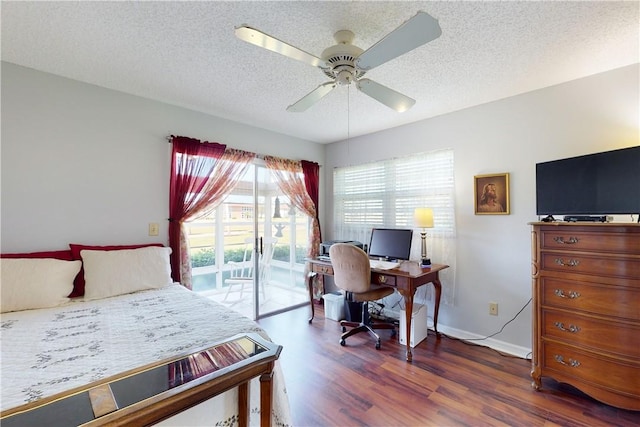 bedroom featuring access to exterior, dark wood-type flooring, a textured ceiling, and ceiling fan